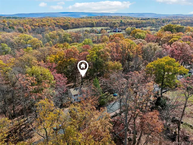 an aerial view of residential house with outdoor space