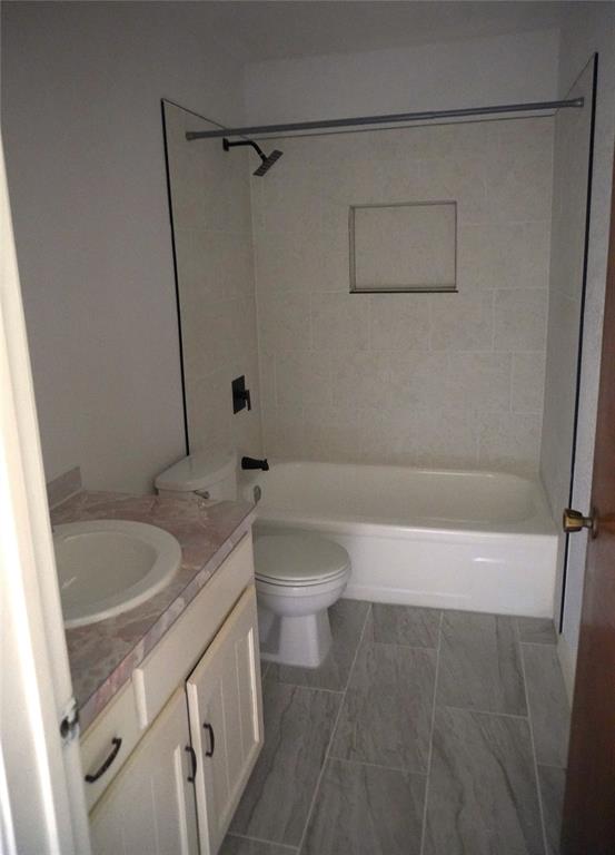 300 Coury Road Everman, TX 76140 - Photo 14 of 29 a bathroom with a granite countertop sink toilet and shower