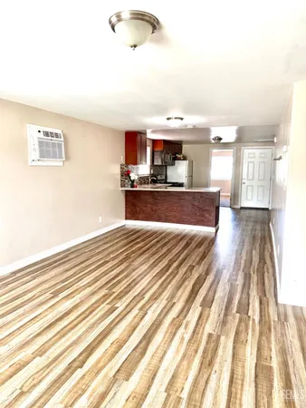 a view of a living room and kitchen