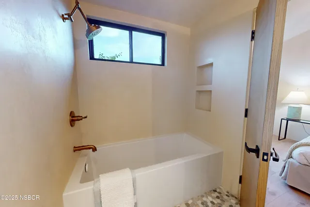 a view of a kitchen with sink a washer and dryer