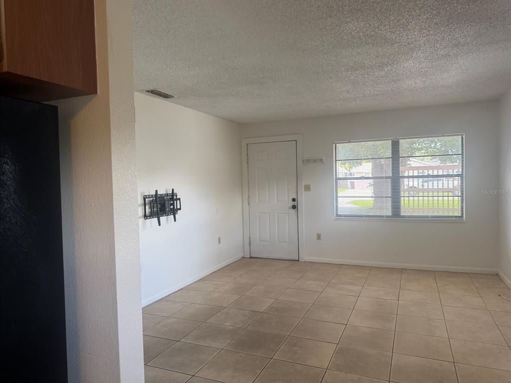1507 Tennessee Avenue St. Cloud, FL 34769 - Photo 5 of 10 an empty room with windows