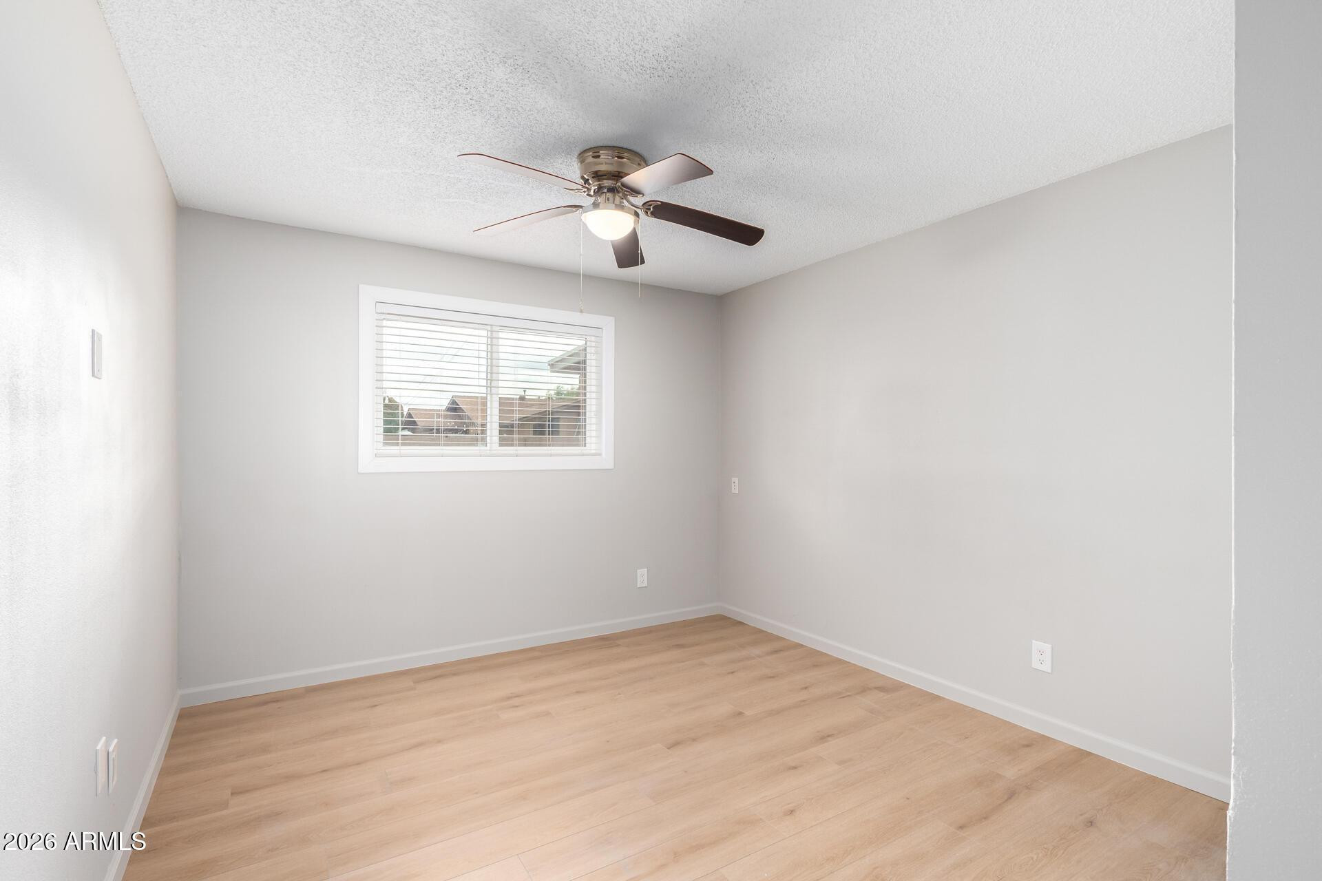 103 East Del Rio Drive Tempe, AZ 85282 - Photo 15 of 28 an empty room with windows and fan