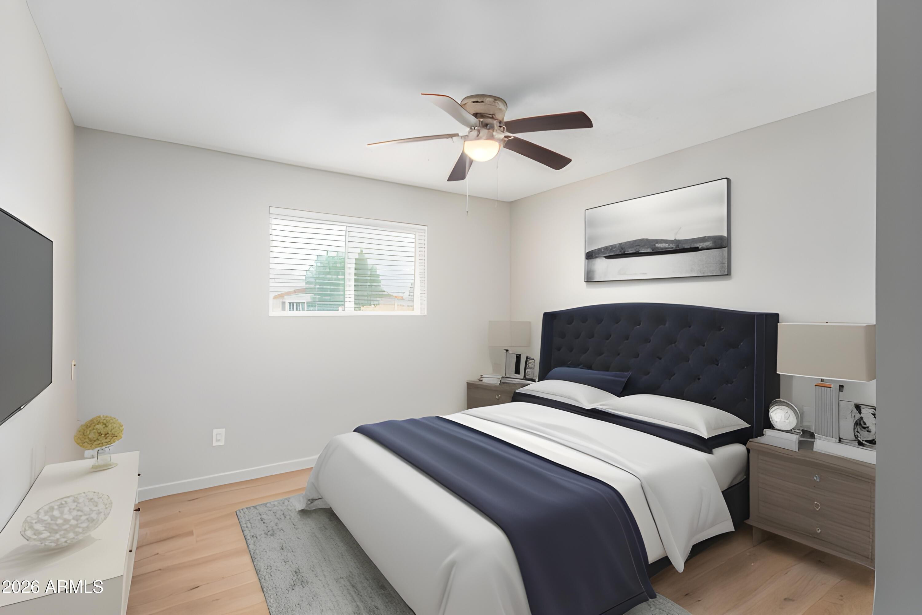 103 East Del Rio Drive Tempe, AZ 85282 - Photo 20 of 28 a bedroom with a bed and a chandelier