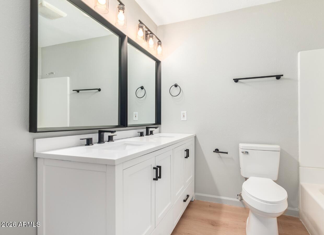 103 East Del Rio Drive Tempe, AZ 85282 - Photo 21 of 28 a bathroom with a sink toilet and mirror
