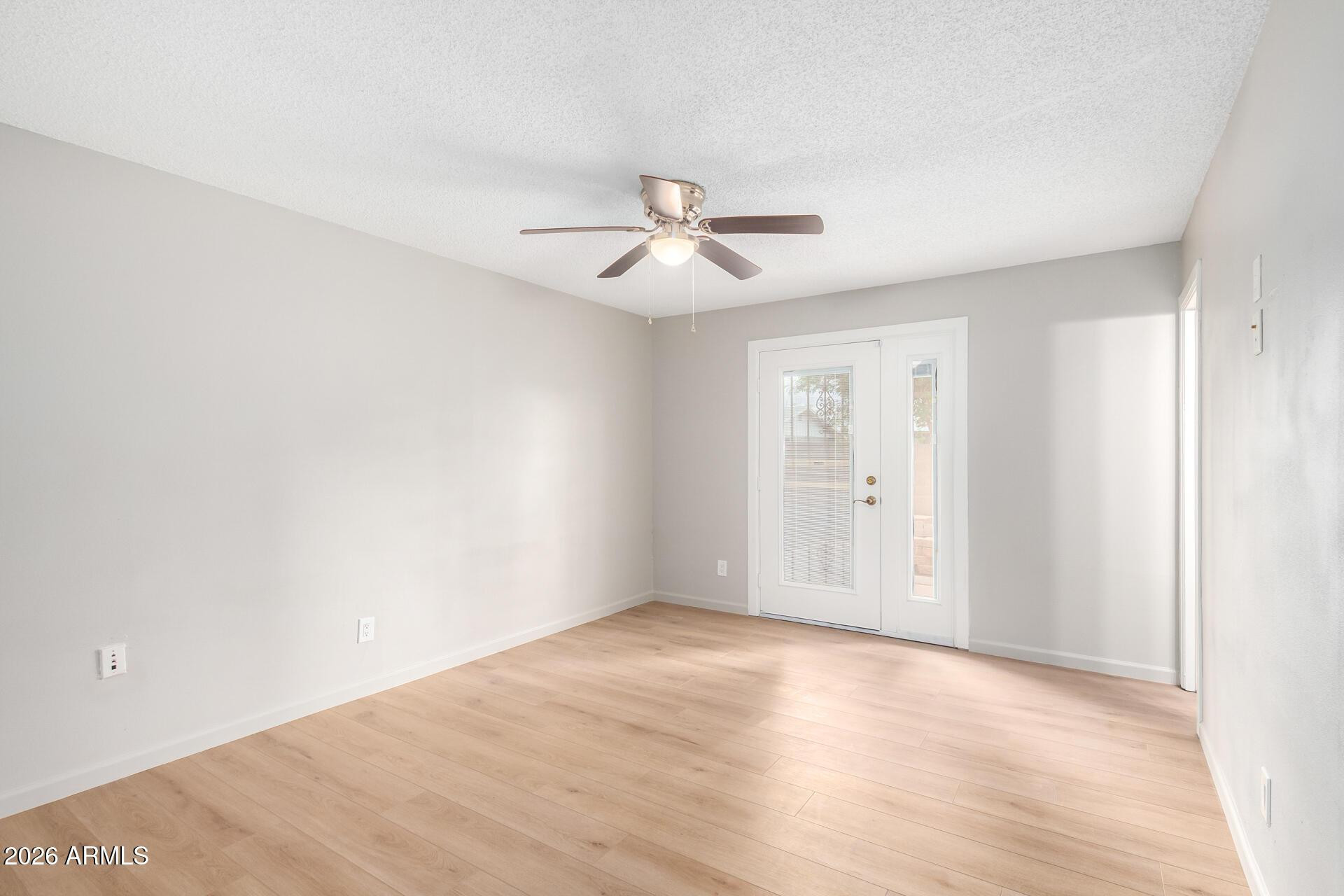 103 East Del Rio Drive Tempe, AZ 85282 - Photo 22 of 28 a view of a room with an empty space and a ceiling fan