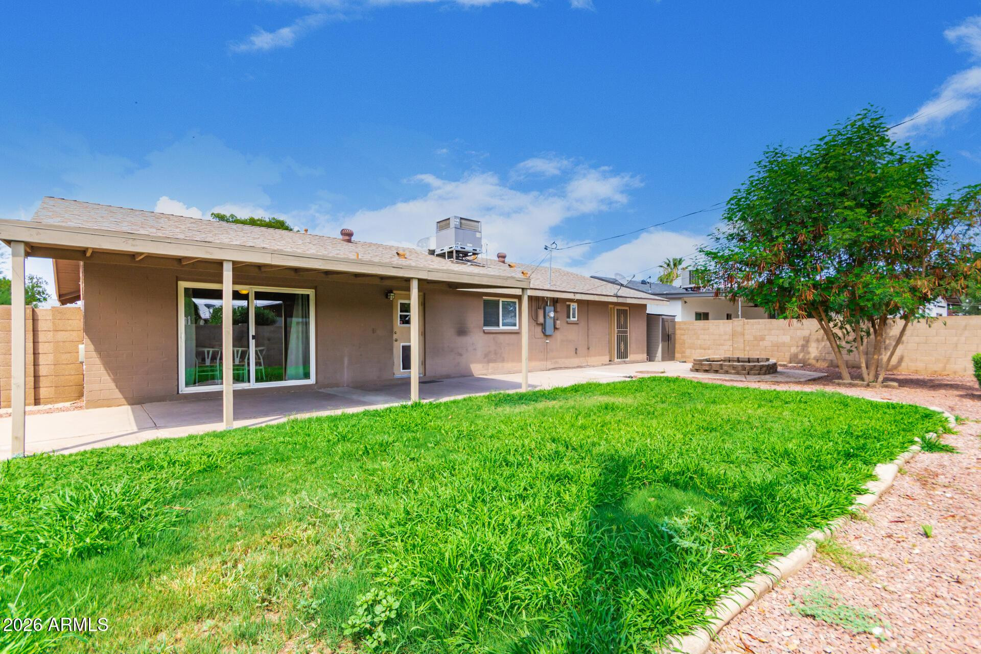 103 East Del Rio Drive Tempe, AZ 85282 - Photo 27 of 28 a view of a house with a yard and sitting area