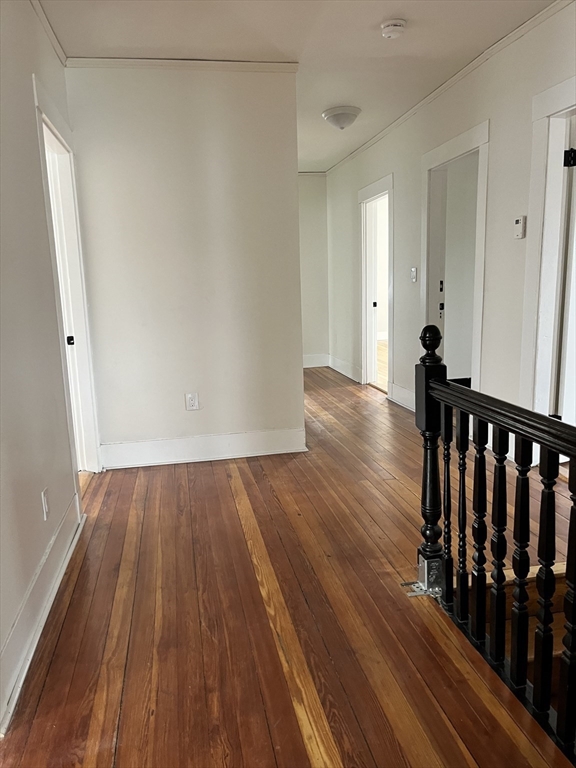 17 Linden Place, Unit 2 Dedham, MA 02026 - Photo 3 of 9 a view of a room with wooden floor