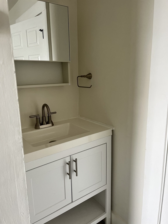 17 Linden Place, Unit 2 Dedham, MA 02026 - Photo 8 of 9 a close view of a sink and cabinets