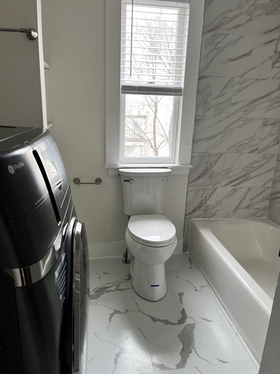 17 Linden Place, Unit 2 Dedham, MA 02026 - Photo 9 of 9 a bathroom with a toilet and a bathtub