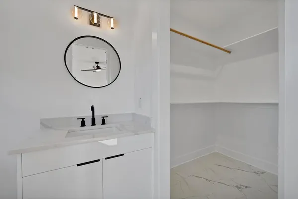 a view of room with window and ceiling fan