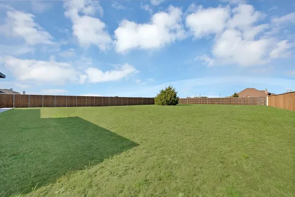 an aerial view of a tennis ground and a large park
