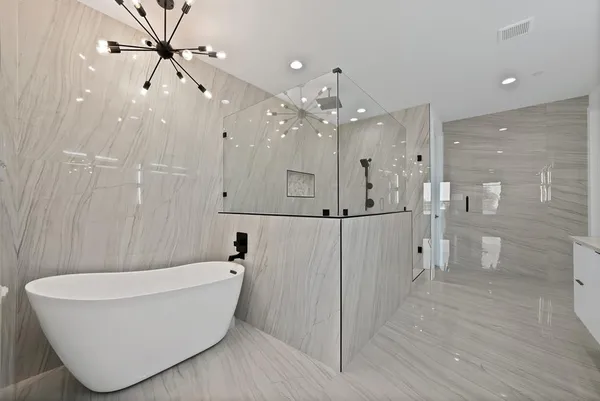 a bathroom with a bathtub and a shower