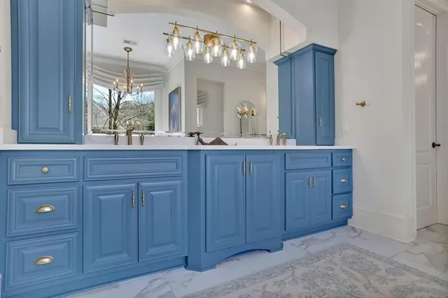 a bed room with furniture and a chandelier