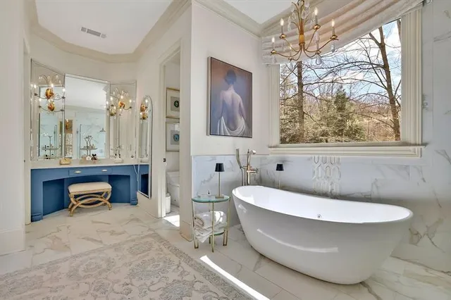 a living room with furniture and a clock