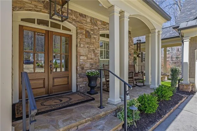a view of living room with furniture and a chandelier