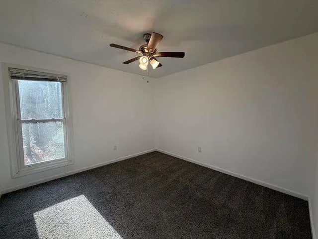 a view of empty room with fan