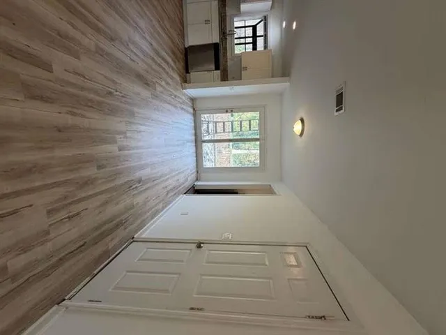 a view of entry way with wooden floor
