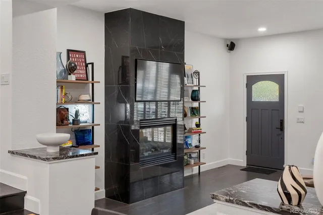 a kitchen with stainless steel appliances granite countertop a refrigerator and a stove top oven