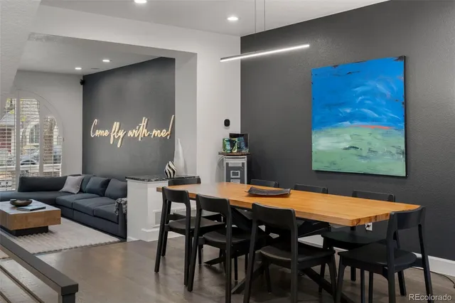a view of a dining room with furniture and window