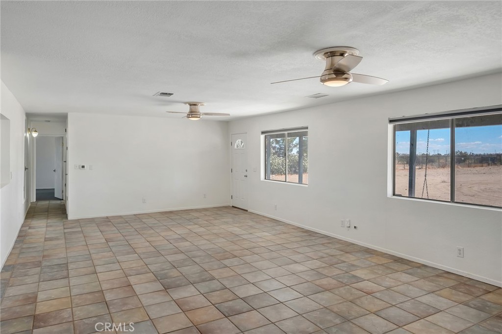 12736 Oasis Road Pinon Hills, CA 92372 - Photo 7 of 33 a view of an empty room and window