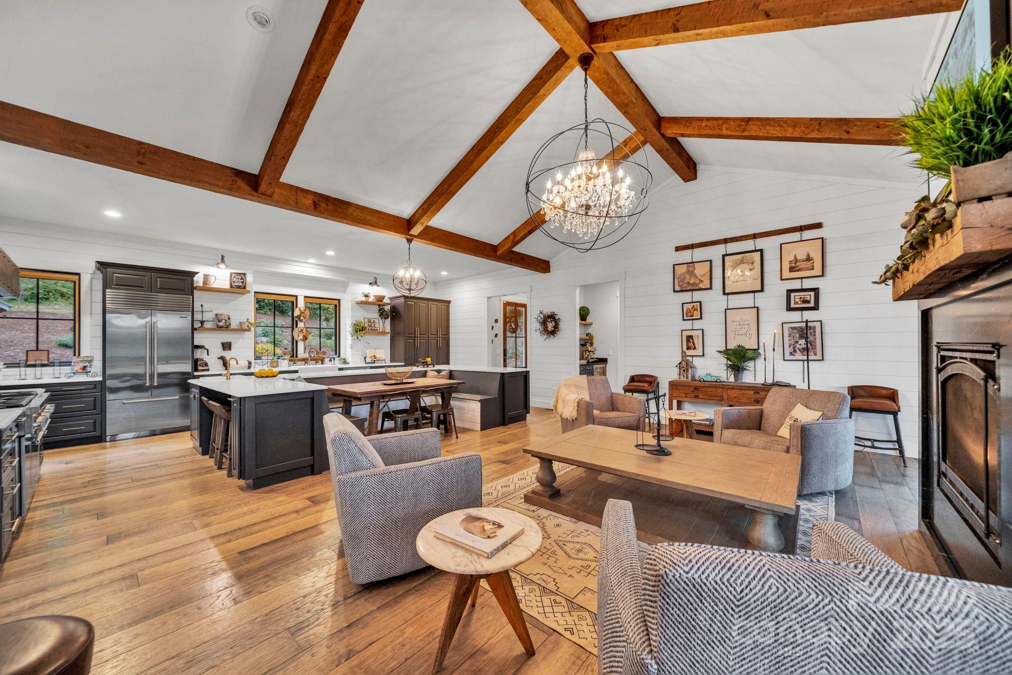 23 Windy Ridge Fairview, NC 28730 - Photo 11 of 47 a living room with furniture a fireplace and a table