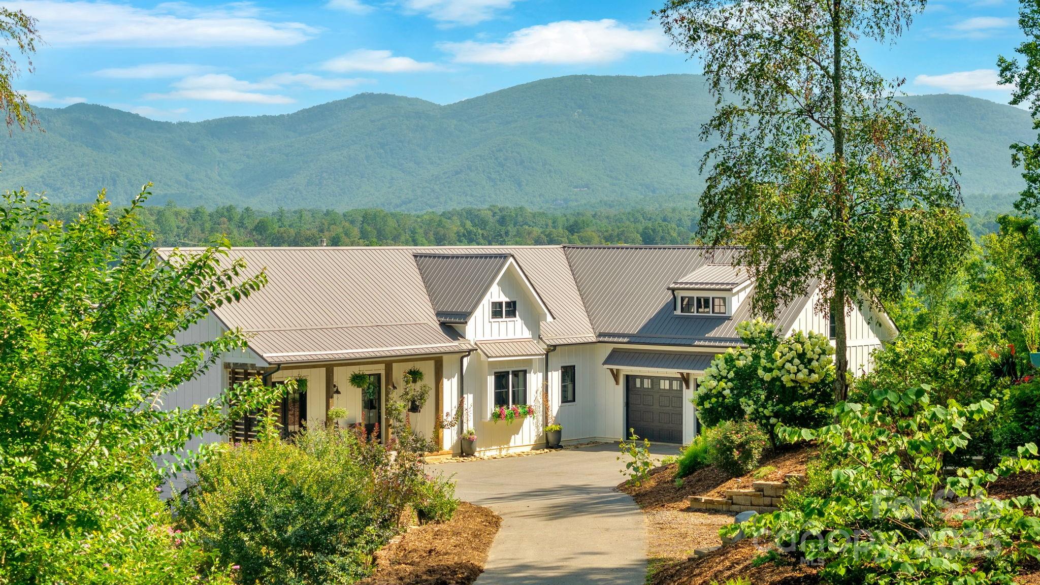 23 Windy Ridge Fairview, NC 28730 - Photo 2 of 47 a aerial view of a house with a yard and potted plants