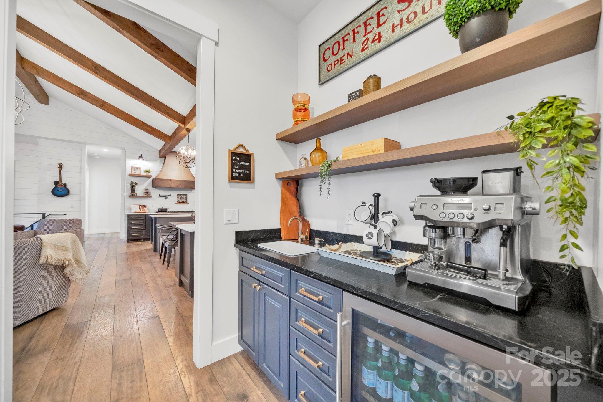 23 Windy Ridge Fairview, NC 28730 - Photo 21 of 47 a kitchen with stainless steel appliances granite countertop a sink stove and wooden floor