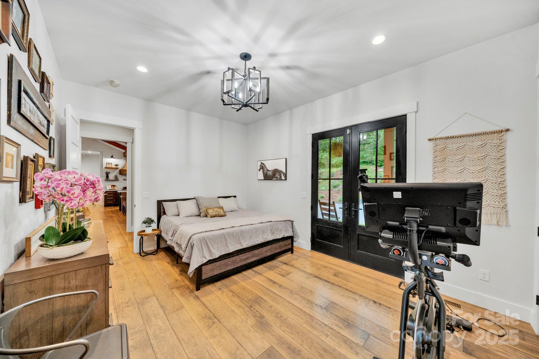 23 Windy Ridge Fairview, NC 28730 - Photo 22 of 47 a spacious bedroom with a bed and wooden floor