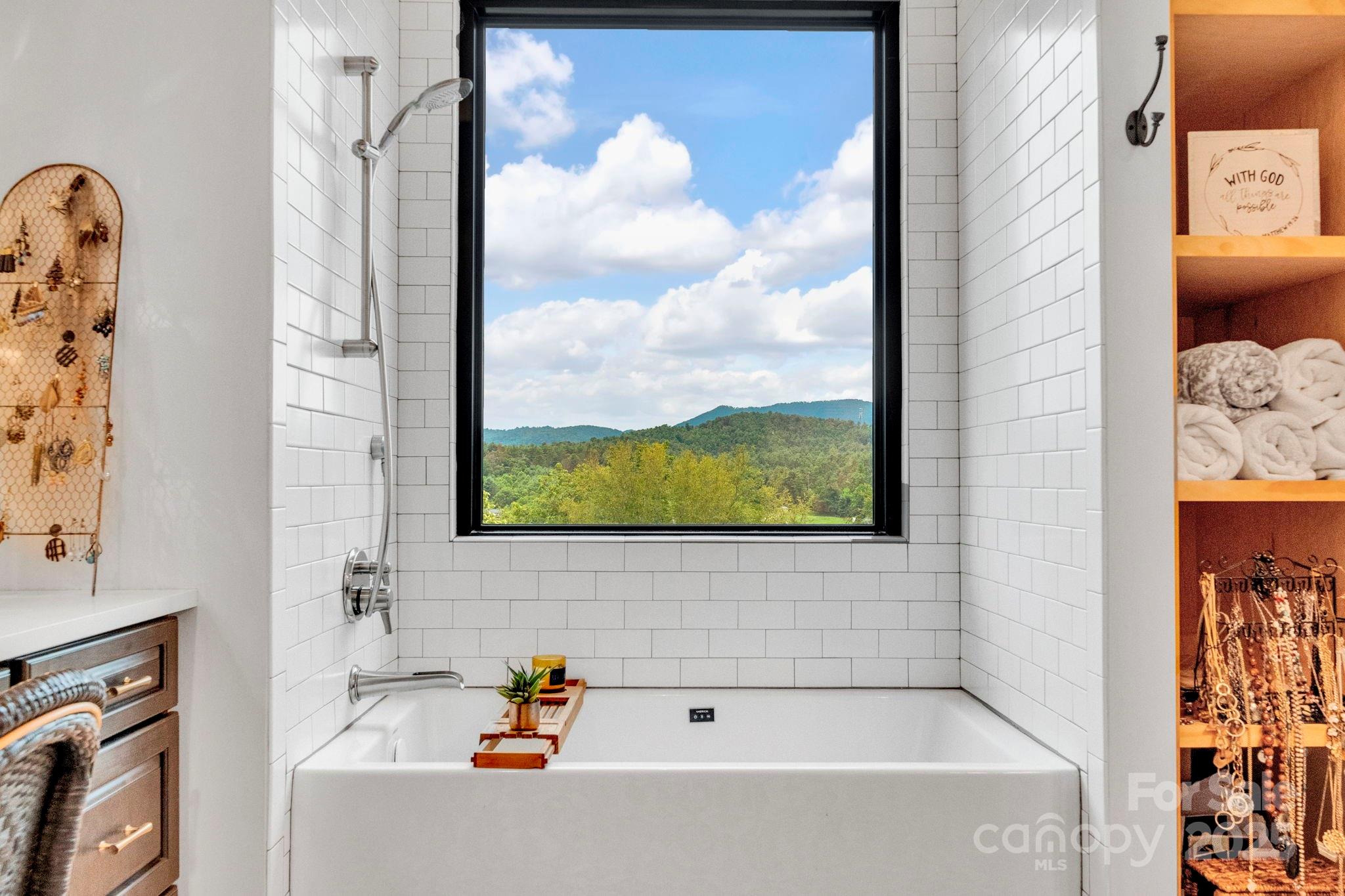 23 Windy Ridge Fairview, NC 28730 - Photo 24 of 47 a bathroom with a bathtub and a shower
