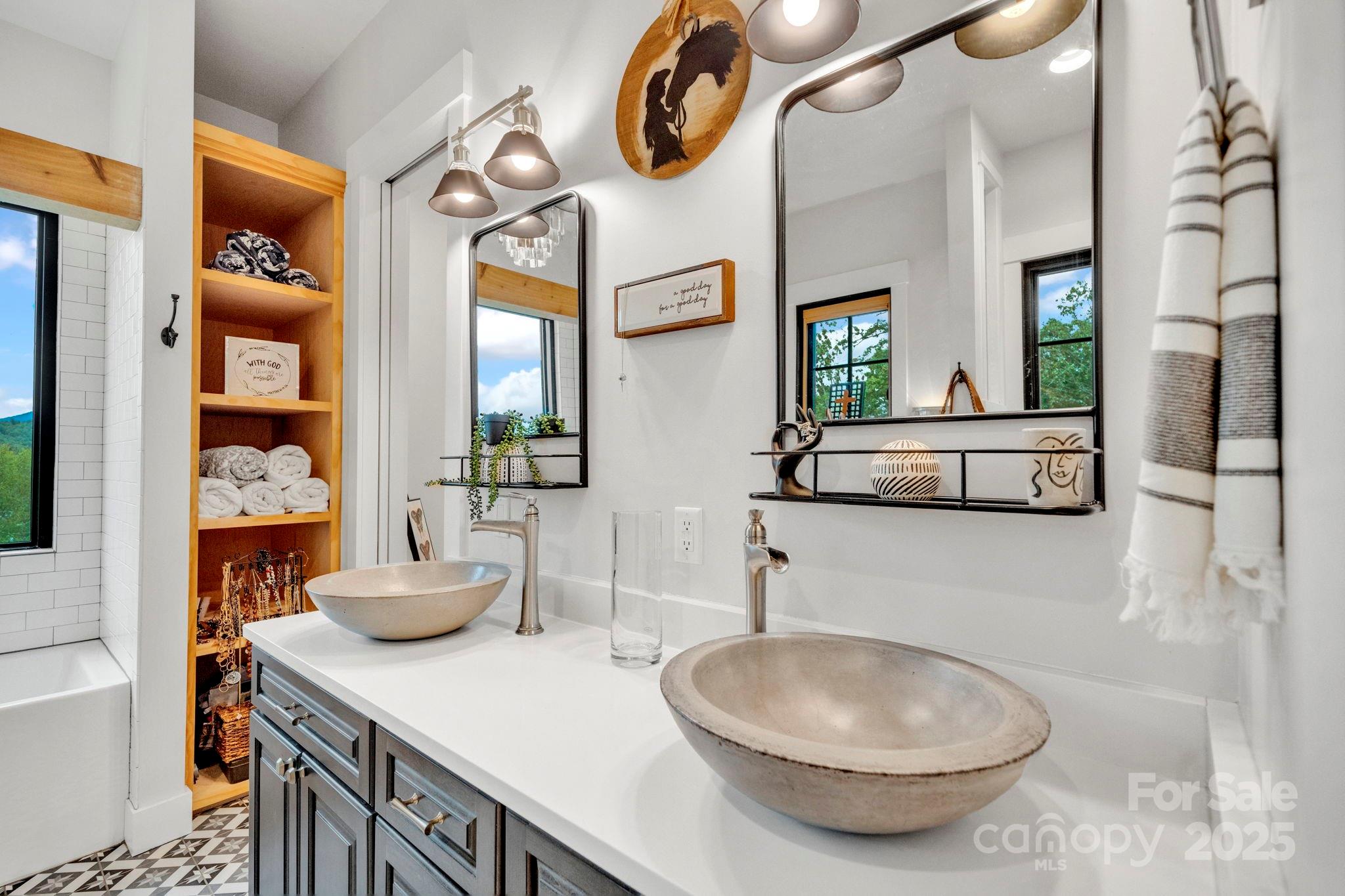 23 Windy Ridge Fairview, NC 28730 - Photo 25 of 47 a bathroom with a sink a mirror and a toilet