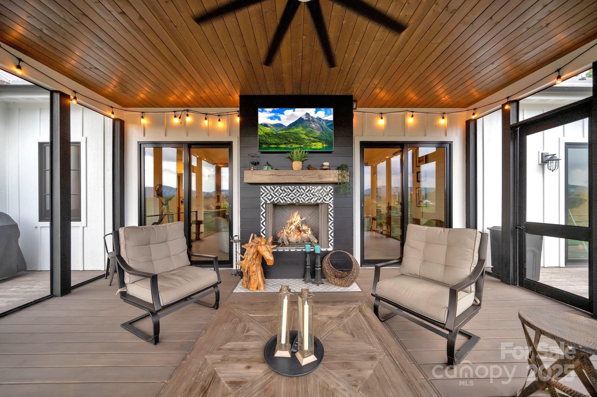 23 Windy Ridge Fairview, NC 28730 - Photo 27 of 47 a living room with furniture and a fireplace