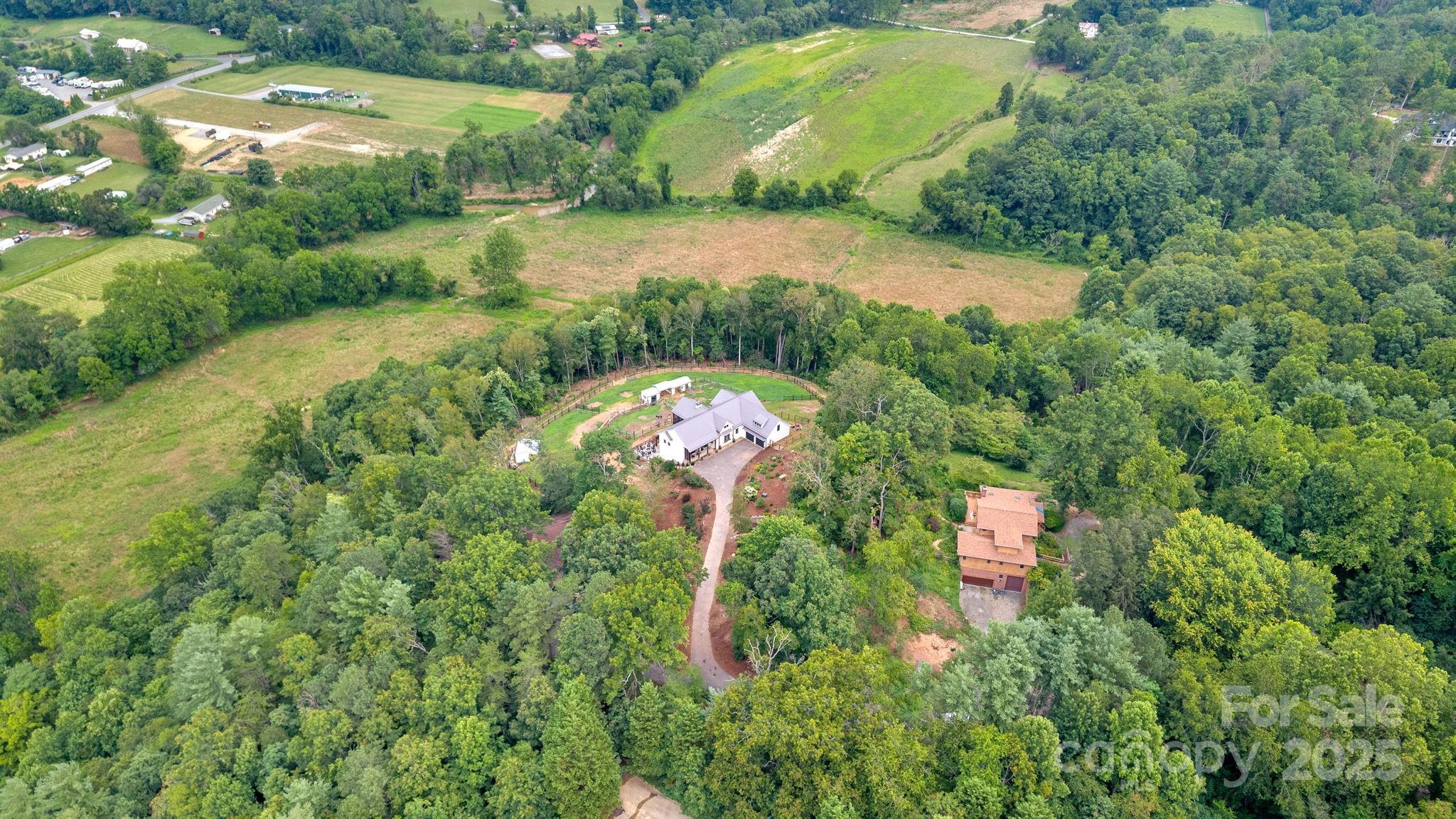 23 Windy Ridge Fairview, NC 28730 - Photo 3 of 47 an aerial view of a house with a yard basket ball court and outdoor seating