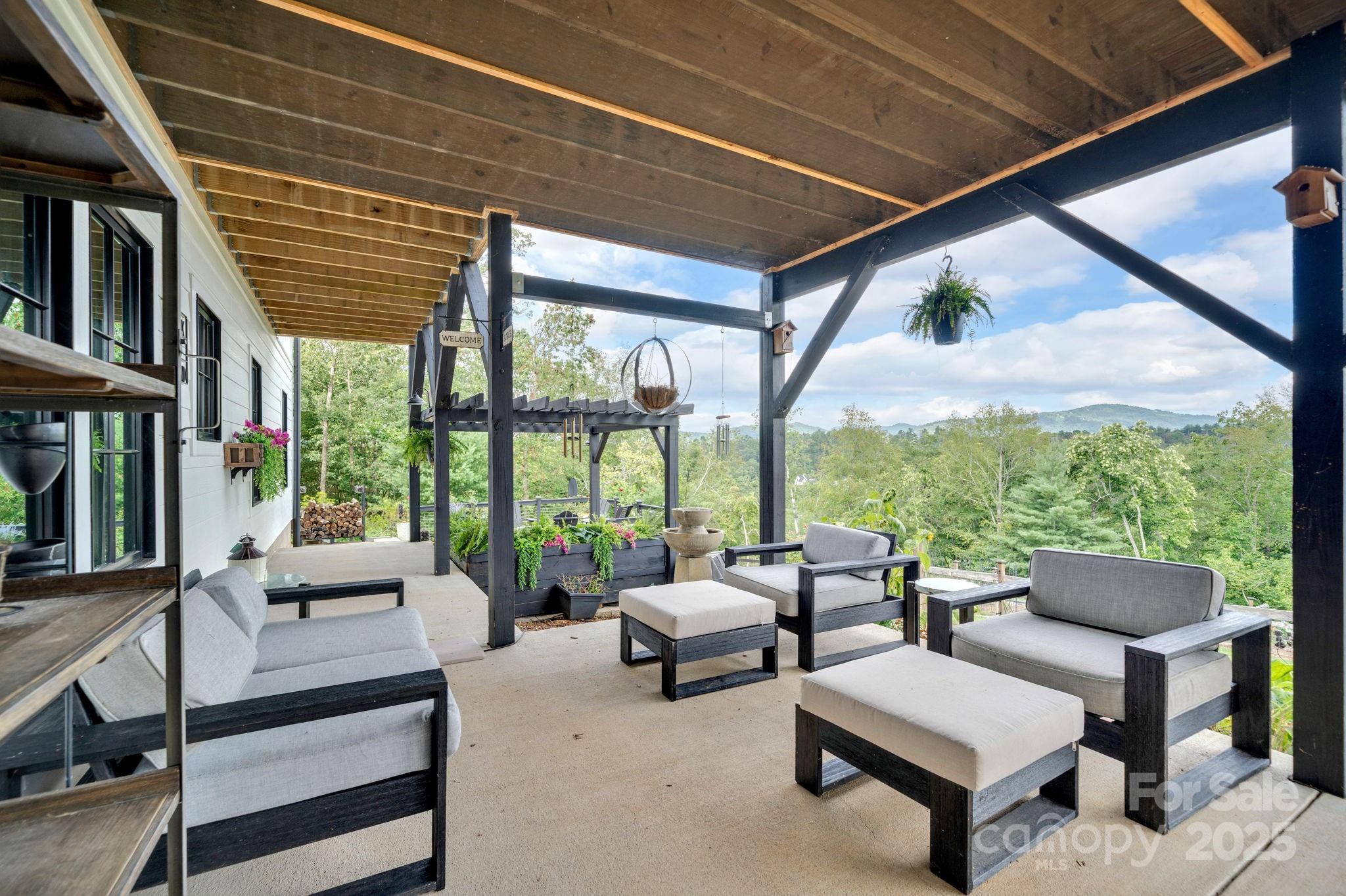 23 Windy Ridge Fairview, NC 28730 - Photo 35 of 47 a building outdoor space with couches and pool view