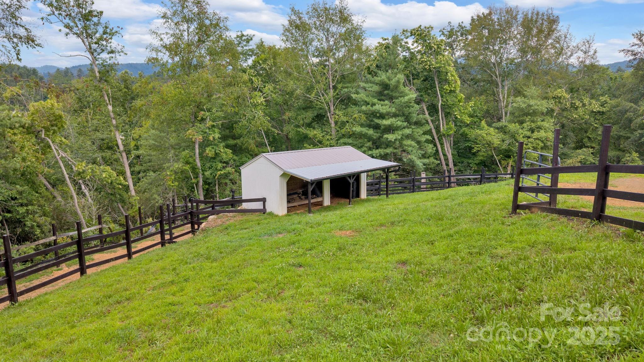 23 Windy Ridge Fairview, NC 28730 - Photo 40 of 47 a view of a house with backyard and a sitting area