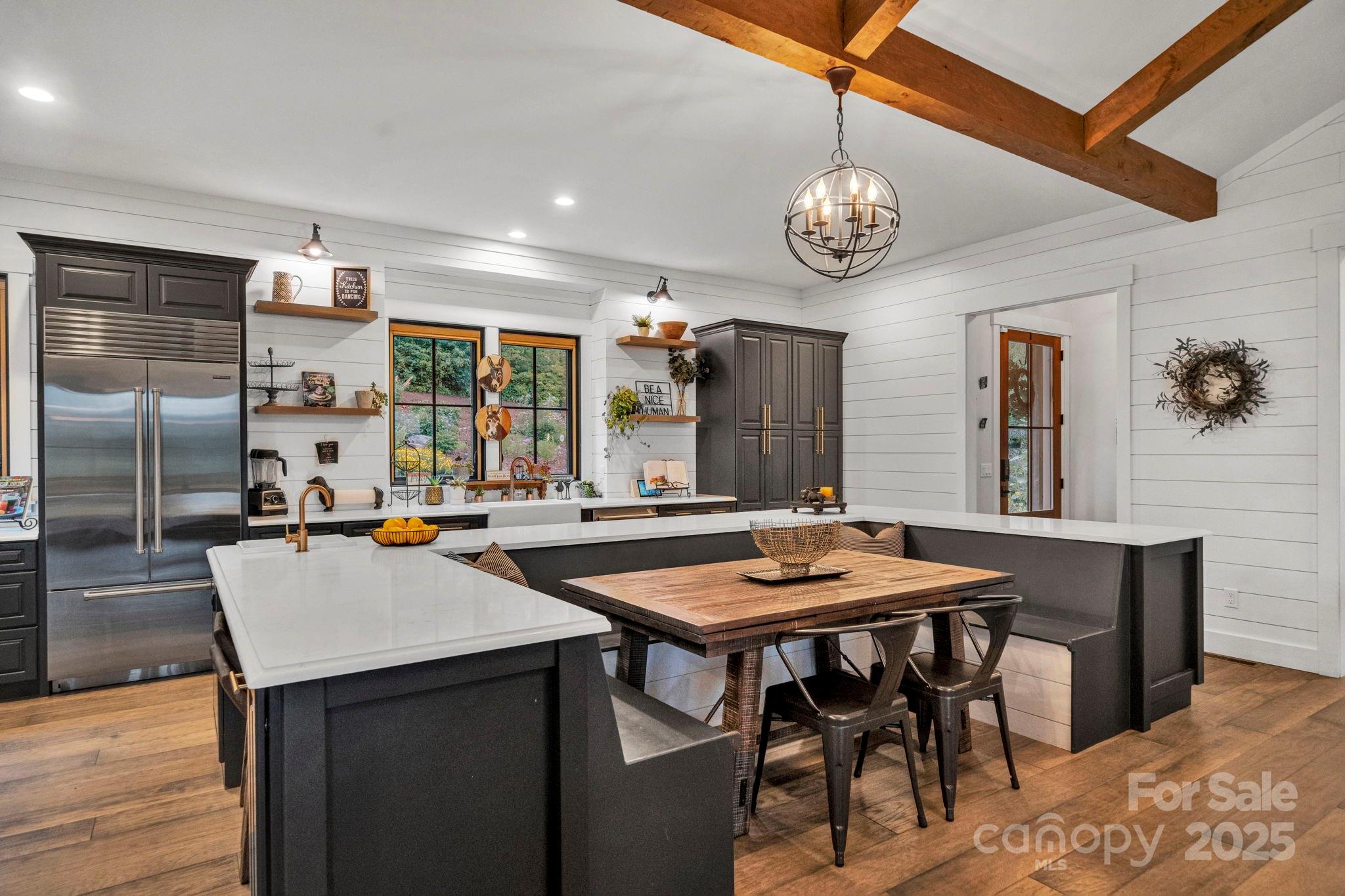 23 Windy Ridge Fairview, NC 28730 - Photo 10 of 47 a view of a kitchen with a table and chairs