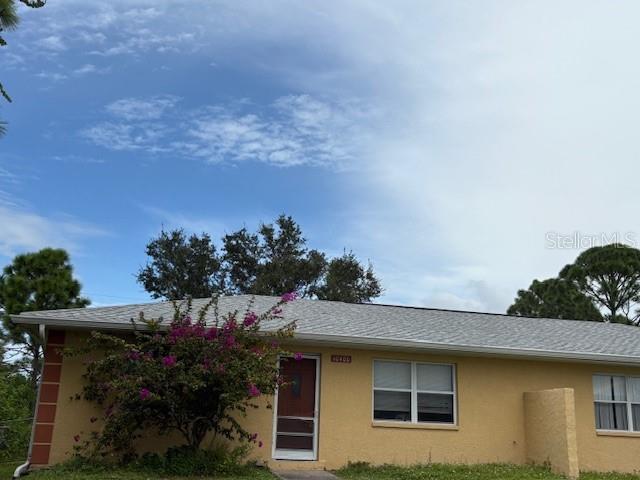 10400 Kidron Avenue Englewood, FL 34224 - Photo 2 of 10 a backyard of a house with lots of green space