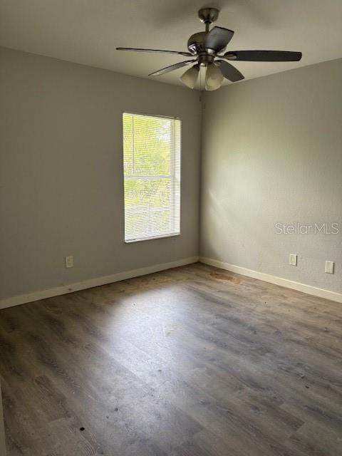 10400 Kidron Avenue Englewood, FL 34224 - Photo 5 of 10 an empty room with a window and a fan