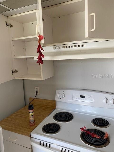 10400 Kidron Avenue Englewood, FL 34224 - Photo 10 of 10 a kitchen with a stove and a microwave