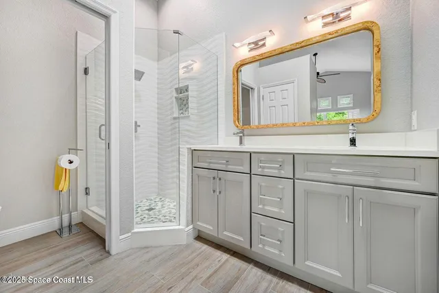a bathroom with a double vanity sink and a mirror