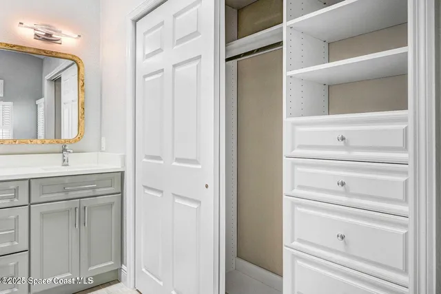 a bathroom with a vanity and a mirror