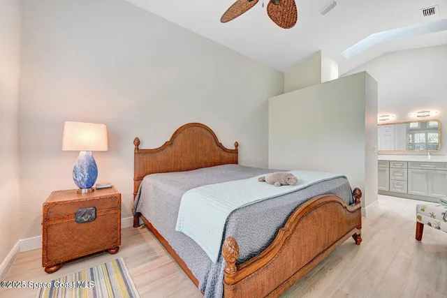 a bedroom with bed and a night stand