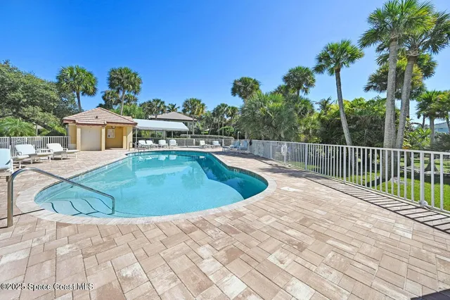 a view of a swimming pool with a patio