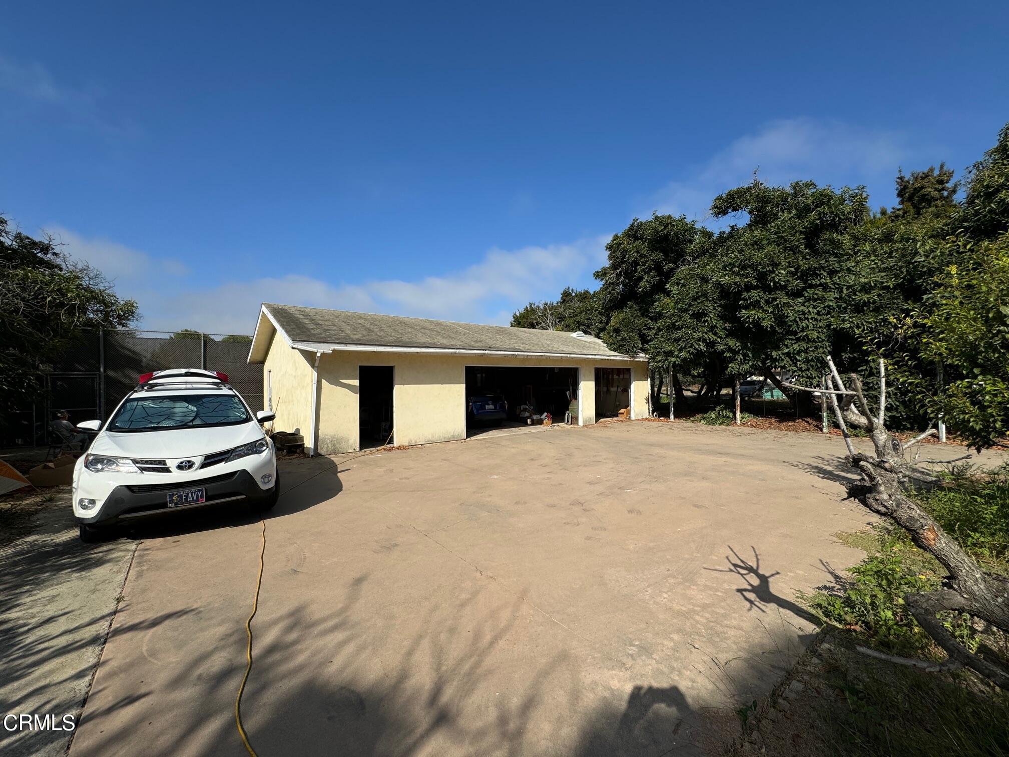 284 East Collins Street Oxnard, CA 93036 - Photo 8 of 18 a car parked in front of a house