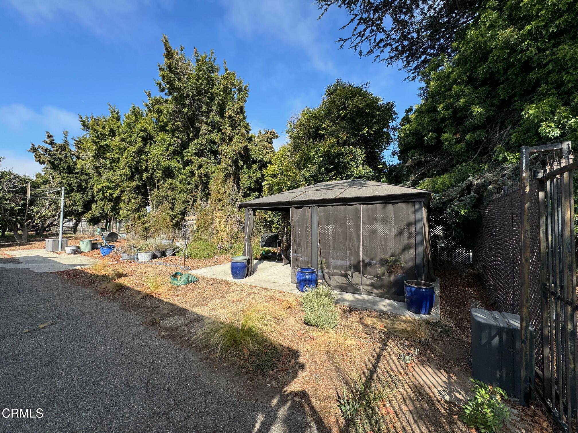 284 East Collins Street Oxnard, CA 93036 - Photo 10 of 18 a view of a house with backyard and sitting area