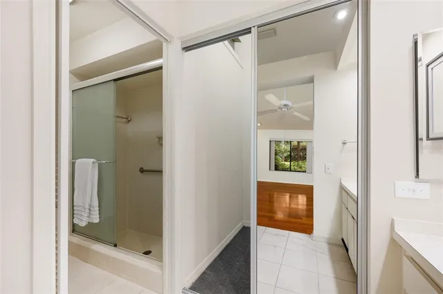 a bathroom with a bathtub and a shower