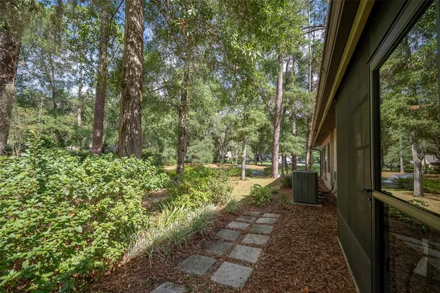 a view of a back yard from a balcony