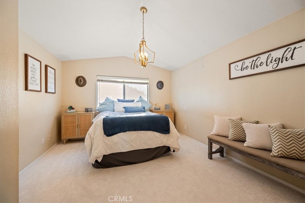 1306 Avenida Pelicanos Oceano, CA 93445 - Photo 12 of 39 a bedroom with a bed and a couch