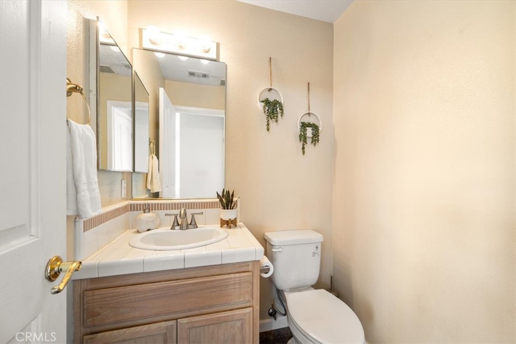 1306 Avenida Pelicanos Oceano, CA 93445 - Photo 22 of 39 a bathroom with a sink mirror toilet and shower