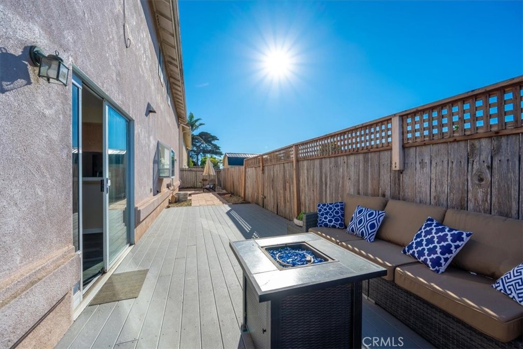 1306 Avenida Pelicanos Oceano, CA 93445 - Photo 25 of 39 a backyard of a house with table and chairs