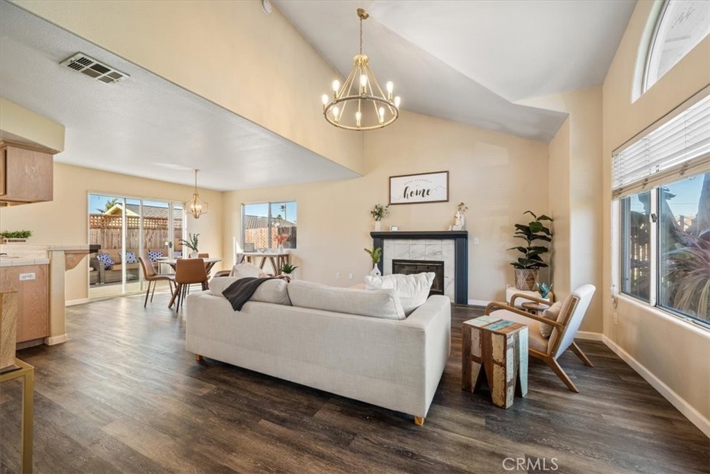 1306 Avenida Pelicanos Oceano, CA 93445 - Photo 5 of 39 a living room with furniture and a chandelier